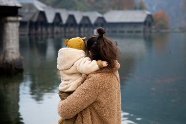mom and baby looking at the lake