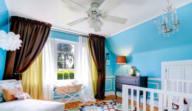 baby's room with ceiling fan