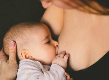 woman breastfeeding baby