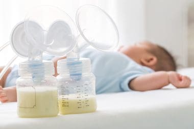 breastmilk beside sleeping baby