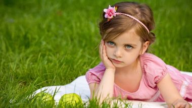 pretty girl sitting on grass