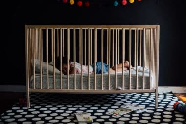 toddler on a crib