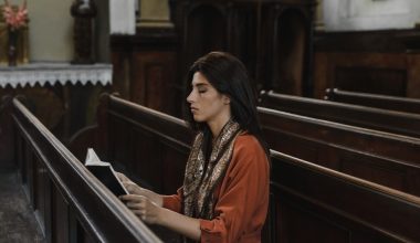 woman reading bible on a church